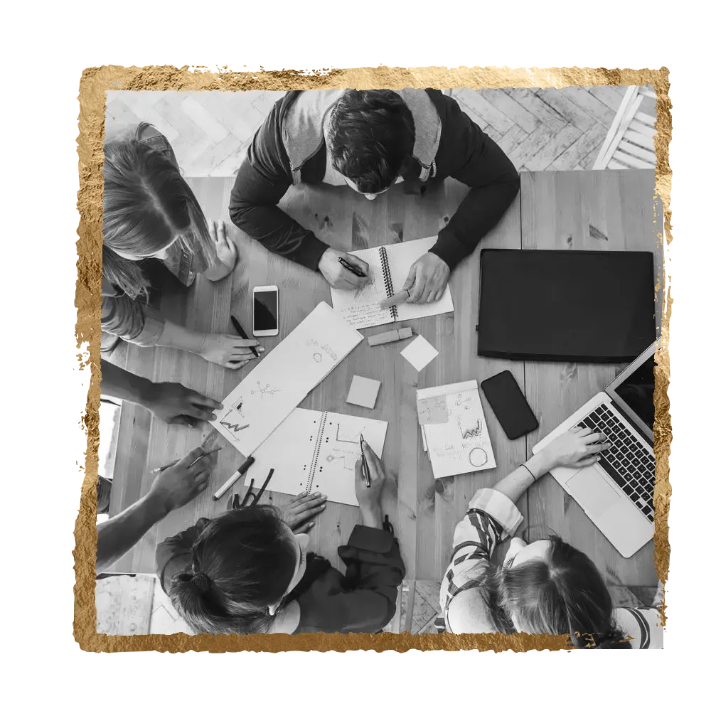 Team of people collaborating around a table